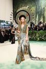 Fashion designer Harris Reed wore a statement jumpsuit and matching hat.