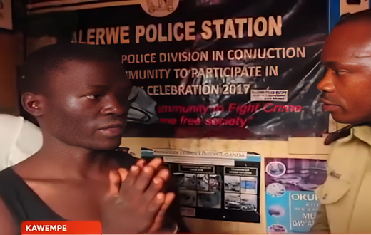 Brian Kawooya exchanging with ASP Rogers Musana at Kalerwe Police Station