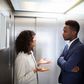 Black couple inside an elevator [Adobe Stock]