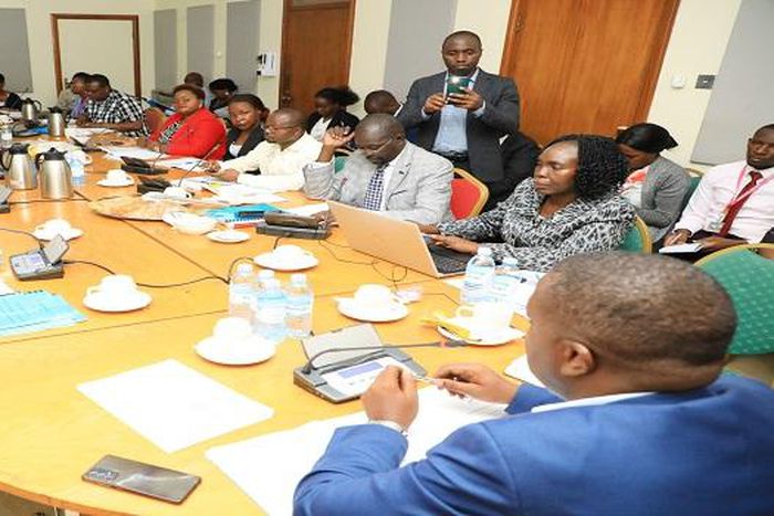 Dr Byanyima (L) appearing before the Health Committee