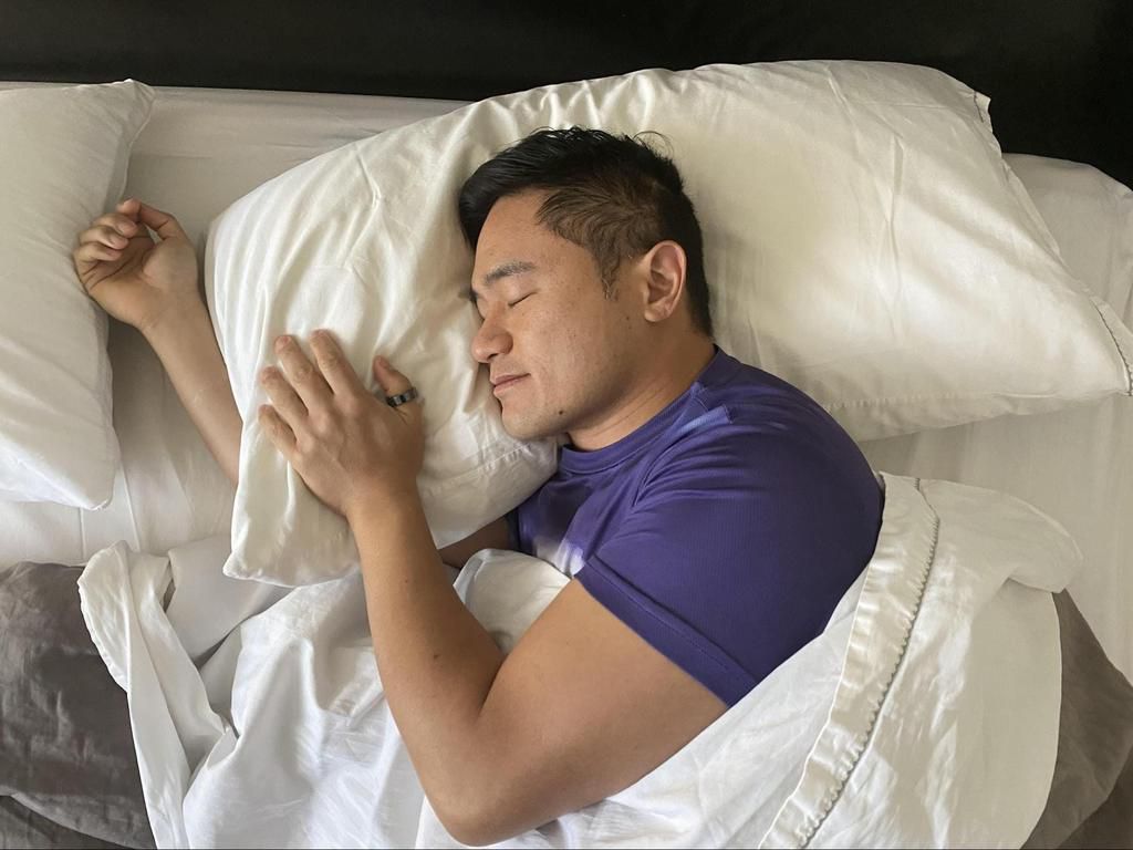 Venture capitalist Jeremy Liew sleeping with his Oura ring on his thumb.Ellie Liew