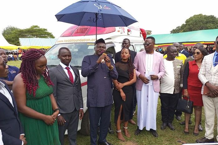 Steven Keddi flanked by his wife Eva handed over to the Butebi RDC Paul Mwidu Kilikwani in the presence of the residents and local leaders