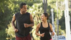 Black man and woman running