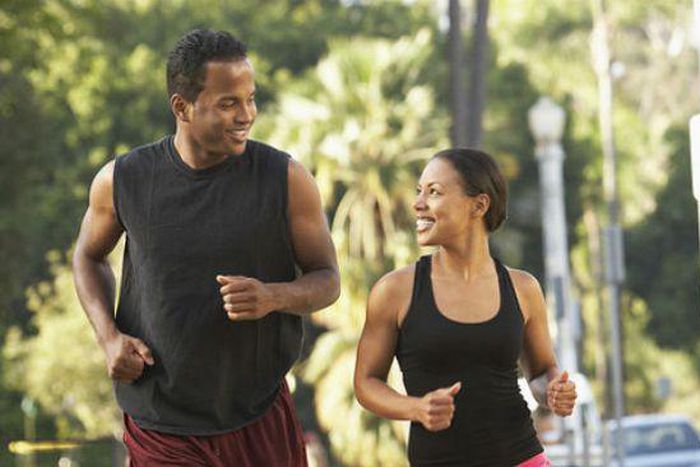 Black man and woman running