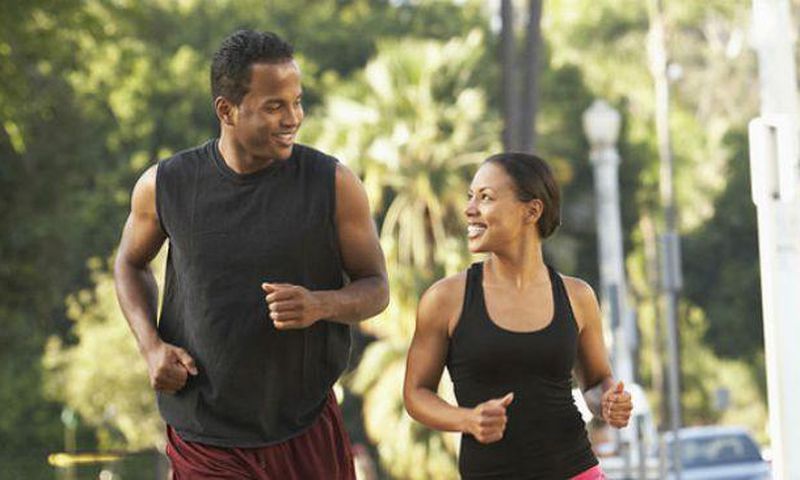 Black man and woman running