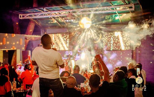 The night pulsed with energy as a vibrant crowd gathered for an evening of music, food, and socializing