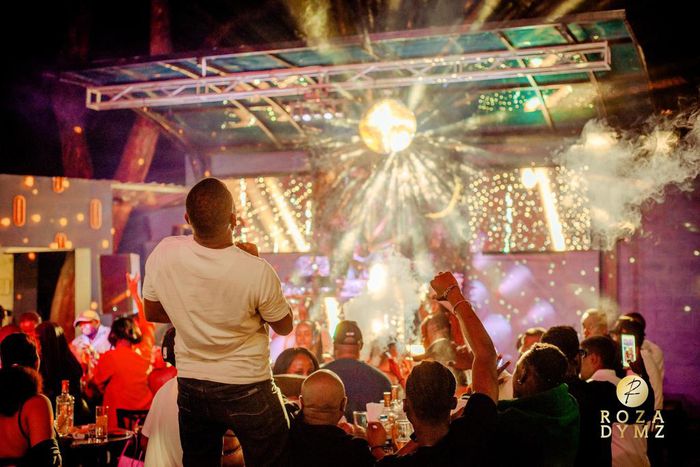 The night pulsed with energy as a vibrant crowd gathered for an evening of music, food, and socializing