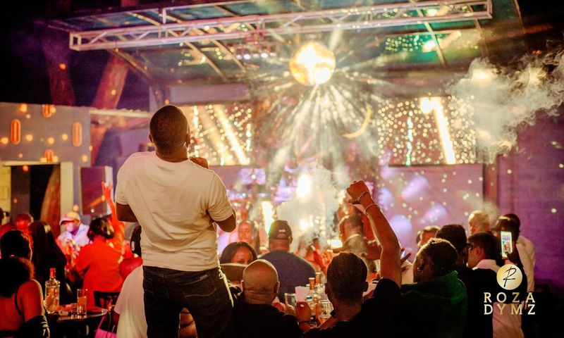 The night pulsed with energy as a vibrant crowd gathered for an evening of music, food, and socializing