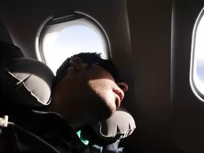 Sleeping on a plane [Thrillist]