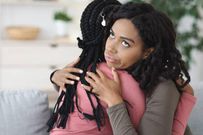 An image of friends hugging