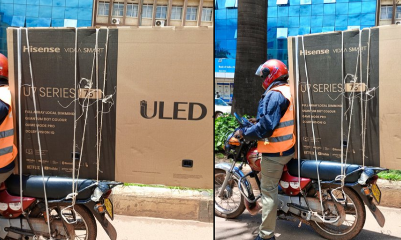 Boda boda rider securing television screen on bike/Courtesy