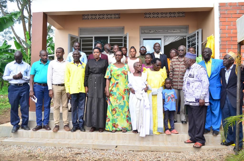 The family of the Late Lwanyaga receiving their house from the minister