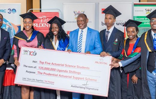 VC Prof Barnabas Nawangwe and Tetteh Ayitevie, the CEO Prudential Assurance Uganda posing with the 2nd cohort graduates