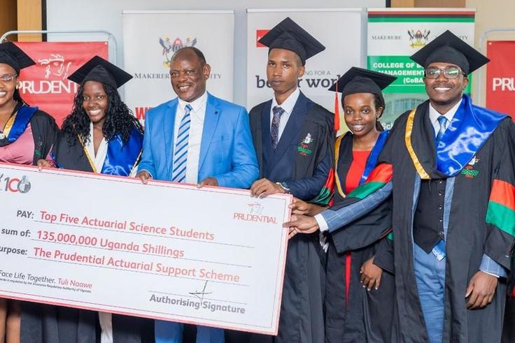 VC Prof Barnabas Nawangwe and Tetteh Ayitevie, the CEO Prudential Assurance Uganda posing with the 2nd cohort graduates
