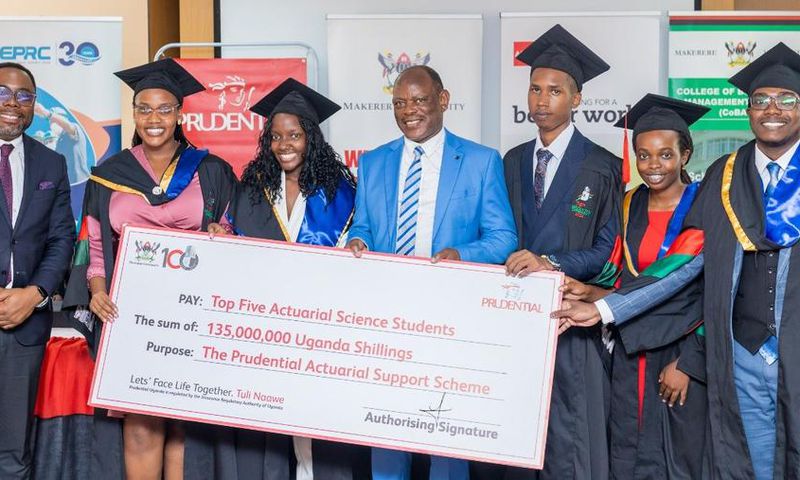 VC Prof Barnabas Nawangwe and Tetteh Ayitevie, the CEO Prudential Assurance Uganda posing with the 2nd cohort graduates