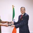 Maj. Gen. Jack Bakasumba receives a souvenir from Ambassador Kumah Gupta