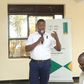 Noah Owomugisha, the aBi Head of Investments—Green Growth and Business Development Services speaking to staff from financial institutions