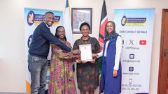 Martha Karua  receiving a change of name certificate from the  Registrar of Political Parties, Anne Nderitu.