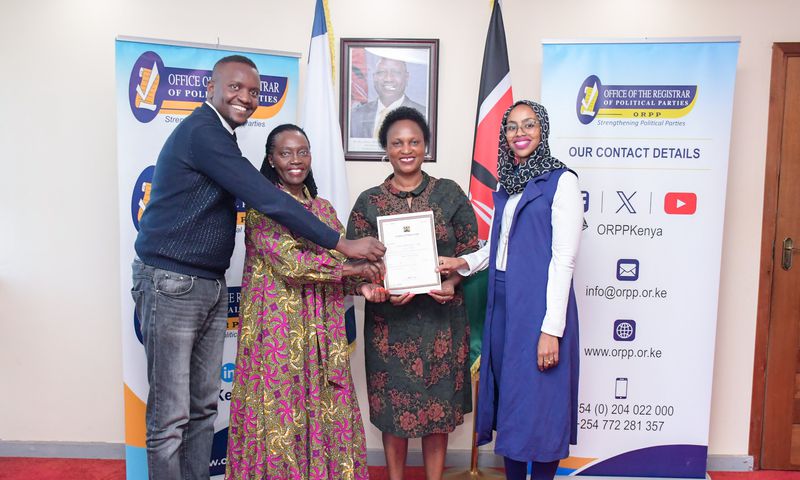 Martha Karua  receiving a change of name certificate from the  Registrar of Political Parties, Anne Nderitu.