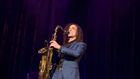 Kenny G on stage, playing the saxophone