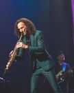 Kenny G on stage playing the saxophone