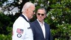 President Joe Biden, wearing a Team USA jacket and walking with his son Hunter Biden, heads toward Marine One on the South Lawn of the White House in Washington, July 26, 2024. (AP)