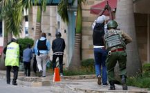 Kenyan security team advance to take on terrorists and rescue civilians in Dusit.