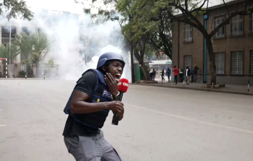 Larry Madowo reacts after being hit by a teargas fragment while covering protests in Nairobi