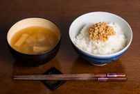 A Japanese breakfast including miso soup and natto (fermented soybeans)