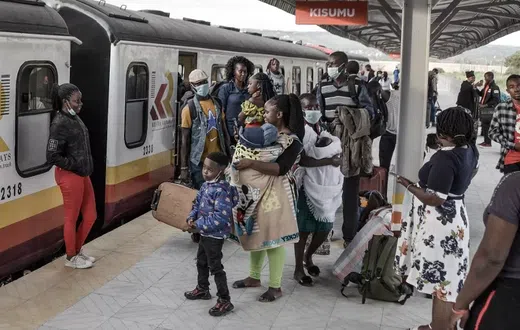 Passengers waiting to board a Kenya Railways train