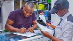 A KRA field officer serving a client