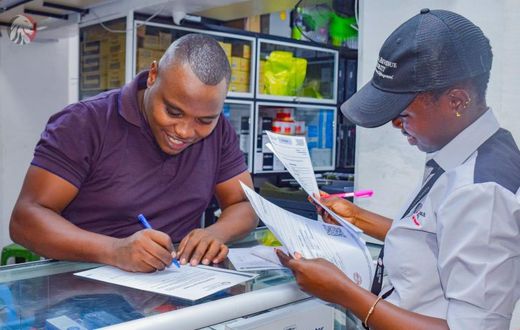 A KRA field officer serving a client