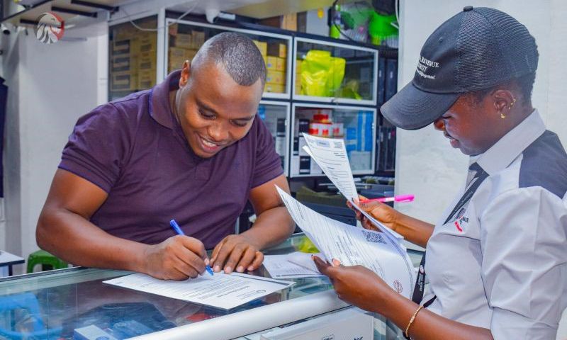 A KRA field officer serving a client