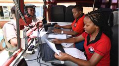 KRA staff working on their desks