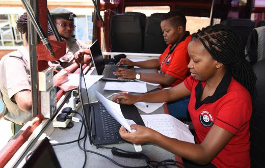 KRA staff working on their desks