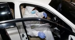 Detectives gathering evidence from the car in which the late Charles Ong'ondo Were who served as Kasipul MP was murdered.