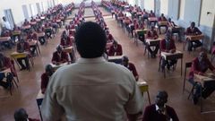 A teacher invigilating an exam