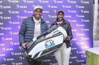 Nancy Wairimu, Overall Gross Lady Winner of the NCBA Golf Series held at Limuru Country Club is awarded by Tirus Mwithiga, NCBA Group Director, Corporate and Investment Banking Advisory
