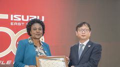 Koji Nakamura, Senior Executive Officer, International Sales Division, Isuzu Motors, gifts Isuzu EA Chair of the Board and Managing Director Rita Kavashe during the Isuzu EA 50th Anniversary celebrations