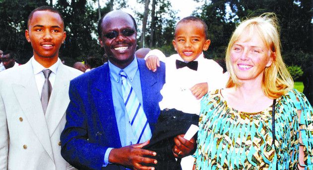 A younger Mukhisa Kituyi with his family and wife