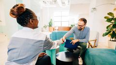 A woman shaking hands with a man