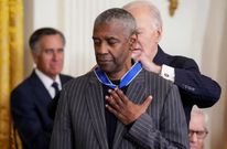 U.S. President Joe Biden presents the Presidential Medal of Freedom to Actor Denzel Washington