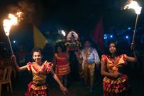 Members of the Paraguay-African cultural group Kamba Cua dance during celebrations in honor of Saint Balthazar, one of the Three Kings, on Epiphany in Fernando de la Mora, Paraguay, just after midnight Sunday, January 9, 2022.
