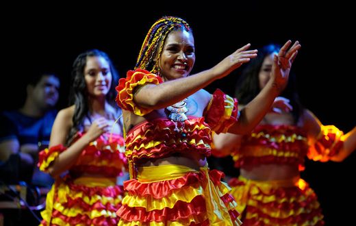 Members of the Paraguay-African cultural group Kamba Cua dance during celebrations in honor of Saint Balthazar, one of the Three Kings, on Epiphany in Fernando de la Mora, Paraguay, just after midnight Sunday, Jan. 9, 2022.