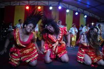 Members of the Paraguay-African cultural group Kamba Cua dance during celebrations in honor of Saint Balthazar, one of the Three Kings, on Epiphany in Fernando de la Mora, Paraguay, just after midnight Sunday, January 9, 2022.