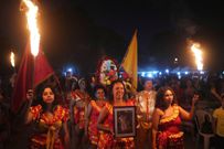 Members of the Paraguay-African cultural group Kamba Cua dance during celebrations in honor of Saint Balthazar, one of the Three Kings, on Epiphany in Fernando de la Mora, Paraguay, just after midnight Sunday, January 9, 2022.