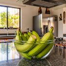Soaking bananas in water after trimming helps reduce sap