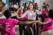 Queen Mary of Denmark (then-Crown Princess) joins Kenyan children in a dance on her visit to the country, November 2018