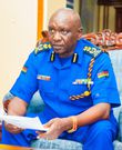 Inspector General Douglas Kanja Kirocho seated and reviewing documents. He has deployed NTSA, undercover officers, specialised units in countrywide crackdown