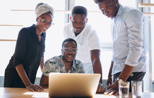 A group of staff working together in an office